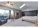 Spacious bedroom with vaulted ceiling, skylight, sitting area, and wooden accents at 36545 Winchester Rd, Elizabeth, CO 80107