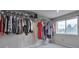 Walk-in closet with ample hanging space and natural light from a window at 36545 Winchester Rd, Elizabeth, CO 80107