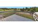 View of a well-maintained wooden deck overlooking the home's large grassy backyard at 36545 Winchester Rd, Elizabeth, CO 80107