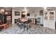 Open concept dining area with tile flooring, decorative fireplace and plenty of natural light at 36545 Winchester Rd, Elizabeth, CO 80107