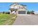 Charming two-story home featuring a well-maintained front yard and an attached two-car garage at 36545 Winchester Rd, Elizabeth, CO 80107