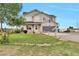 Charming two-story home featuring a well-maintained front yard and an attached two-car garage at 36545 Winchester Rd, Elizabeth, CO 80107