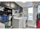 Well-organized laundry room with modern appliances and plenty of storage space at 36545 Winchester Rd, Elizabeth, CO 80107