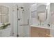 Updated bathroom with a glass shower, modern vanity, and neutral tile at 2931 N Josephine St, Denver, CO 80205