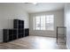 Bright bedroom featuring a ceiling fan and a window at 10035 E Carolina Pl # 201, Aurora, CO 80247