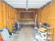 Spacious garage with plywood walls, pegboard and storage at 10035 E Carolina Pl # 201, Aurora, CO 80247