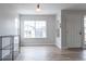 Bright living room features a large window and an entrance door at 10035 E Carolina Pl # 201, Aurora, CO 80247