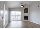 Living room features a fireplace, ceiling fan, and sliding glass doors to the outdoor deck at 10035 E Carolina Pl # 201, Aurora, CO 80247