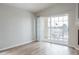 Bright living room with sliding glass doors leading to a balcony at 10035 E Carolina Pl # 201, Aurora, CO 80247