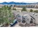 A high-angle shot showcases a residential neighborhood with snow covered mountains on the horizon at 3228 47Th, Boulder, CO 80301