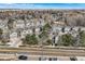 Scenic aerial view of townhomes, mature trees, and roadway, showcasing community charm and location at 3228 47Th, Boulder, CO 80301