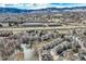 High altitude view of townhomes, nearby pond and mountains, showcasing location and community at 3228 47Th, Boulder, CO 80301