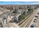 Aerial view of townhomes and road, highlighting neighborhood layout and access to main thoroughfare at 3228 47Th, Boulder, CO 80301