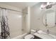 Clean bathroom features a shower-tub combo, a modern sink, and a round mirror at 3228 47Th, Boulder, CO 80301