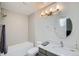 Bright bathroom featuring a modern light fixture, shower and tub combo, and contemporary fixtures at 3228 47Th, Boulder, CO 80301