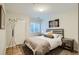 Bright bedroom with hardwood floors, a comfortable bed with throw pillows, and ample closet space at 3228 47Th, Boulder, CO 80301