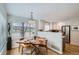 Cozy dining area with a modern table set and stainless steel appliances in the adjacent kitchen at 3228 47Th, Boulder, CO 80301