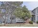 Charming townhouse featuring a porch and landscaped front yard, offering a warm welcome to the residence at 3228 47Th, Boulder, CO 80301
