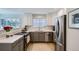 Bright kitchen featuring stainless steel appliances, ample counter space, and modern design at 3228 47Th, Boulder, CO 80301