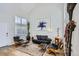 Bright living room with modern furniture, hardwood floors, large windows, and stylish decor at 3228 47Th, Boulder, CO 80301