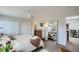 Bright main bedroom has a large closet, a ceiling fan, and access to an office and bathroom at 3228 47Th, Boulder, CO 80301