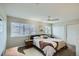 Comfortable main bedroom features a ceiling fan, large windows, and a closet for ample storage at 3228 47Th, Boulder, CO 80301