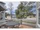 Relaxing patio with table and chairs offers a great outdoor space to enjoy the surrounding greenery at 3228 47Th, Boulder, CO 80301
