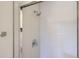 The shower features tiled walls, a shower head and handle, and a glass door at 3228 47Th, Boulder, CO 80301