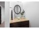 Small powder room with a glass vessel sink and granite countertop at 5370 Pine Ridge Rd, Golden, CO 80403