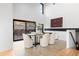 Bright dining room with large sliding glass doors and mountain views at 5370 Pine Ridge Rd, Golden, CO 80403