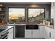 Modern kitchen features stainless steel appliances and mountain views at 5370 Pine Ridge Rd, Golden, CO 80403