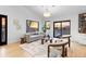 Open concept living room with hardwood floors and natural light at 5370 Pine Ridge Rd, Golden, CO 80403