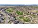 A scenic aerial view of a community adjacent to a golf course at 7965 S Vandriver Way, Aurora, CO 80016