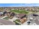 An aerial view showing a home's proximity to a golf course and other houses at 7965 S Vandriver Way, Aurora, CO 80016