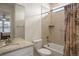Bright bathroom with shower-tub combo, white vanity, and tile details at 7965 S Vandriver Way, Aurora, CO 80016