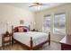 Well-lit bedroom with a comfortable queen bed, ceiling fan, and a lot of light at 7965 S Vandriver Way, Aurora, CO 80016