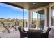 Outdoor deck features seating overlooking a golf course and other residential homes in the community at 7965 S Vandriver Way, Aurora, CO 80016