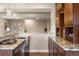 Stylish kitchen with granite countertops, stainless steel appliances, and pendant lighting at 7965 S Vandriver Way, Aurora, CO 80016