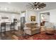 Spacious living room open to the modern kitchen and dining area at 7965 S Vandriver Way, Aurora, CO 80016