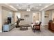 Inviting recreation room with a treadmill, a seating area, and a TV at 7965 S Vandriver Way, Aurora, CO 80016