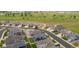 Aerial shot of a residential area near a golf course with lush green fields, offering a scenic view at 8888 Falcon St, Longmont, CO 80504