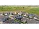Aerial view of homes near a golf course, showcasing the neighborhood's layout and green surroundings at 8888 Falcon St, Longmont, CO 80504