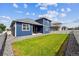 Expansive backyard with lush lawn, patio, and privacy fence, creating a perfect outdoor oasis at 8888 Falcon St, Longmont, CO 80504