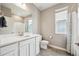 Bright bathroom featuring a white vanity, modern fixtures, and a shower-tub combination at 8888 Falcon St, Longmont, CO 80504