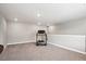 Spacious bonus room with a treadmill and ample open space at 8888 Falcon St, Longmont, CO 80504