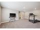 Versatile bonus room with a television and exercise equipment at 8888 Falcon St, Longmont, CO 80504