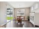 Bright dining area with natural light, views of the backyard and stylish white cabinets at 8888 Falcon St, Longmont, CO 80504