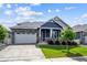 Charming single-Gathering home with stone accents, a well-manicured lawn and an attached two-car garage offers curb appeal at 8888 Falcon St, Longmont, CO 80504