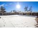 Large backyard with a snow covered ground, providing a peaceful atmosphere at 7674 Stuart St, Westminster, CO 80030