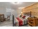 Basement bedroom with wood-paneled accent wall and rustic decor at 7674 Stuart St, Westminster, CO 80030